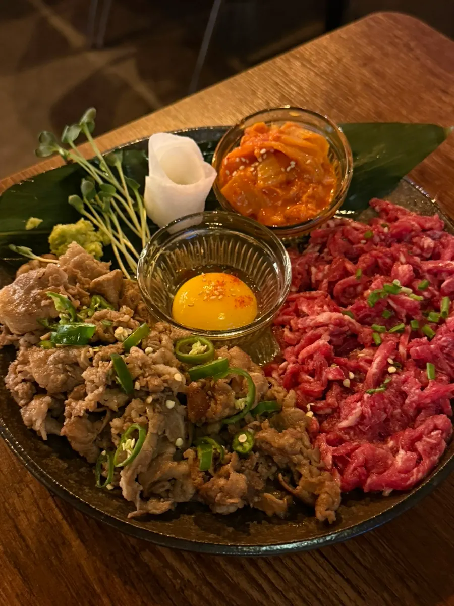 A plate of 1++ Korean beef yukhoe chadol wrap arranged by color