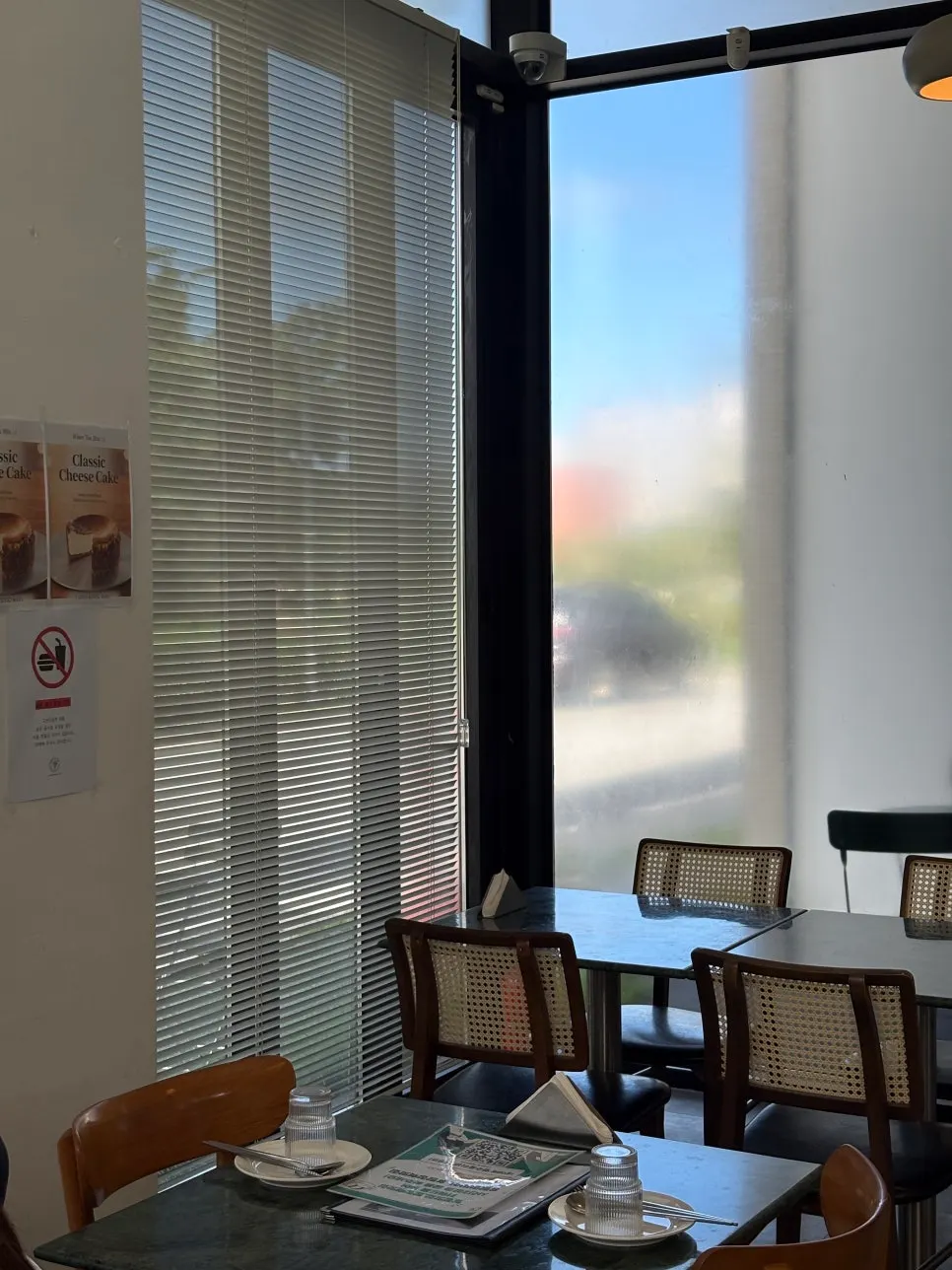 Interior lit by full-height windows at When You Bite