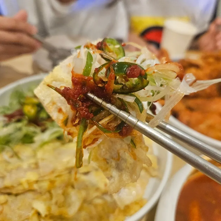 Egg-coated Jeonju-style pork jeon, pan-fried