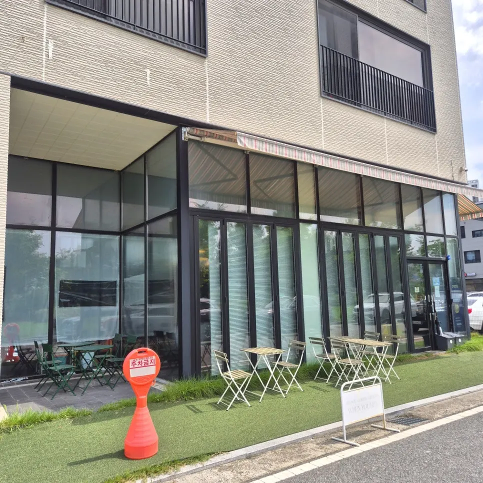 Exterior of When You Bite with large windows and outdoor terrace seating