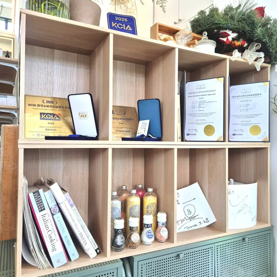 Korea Consumer Industry Assessment excellence award displayed on a shelf