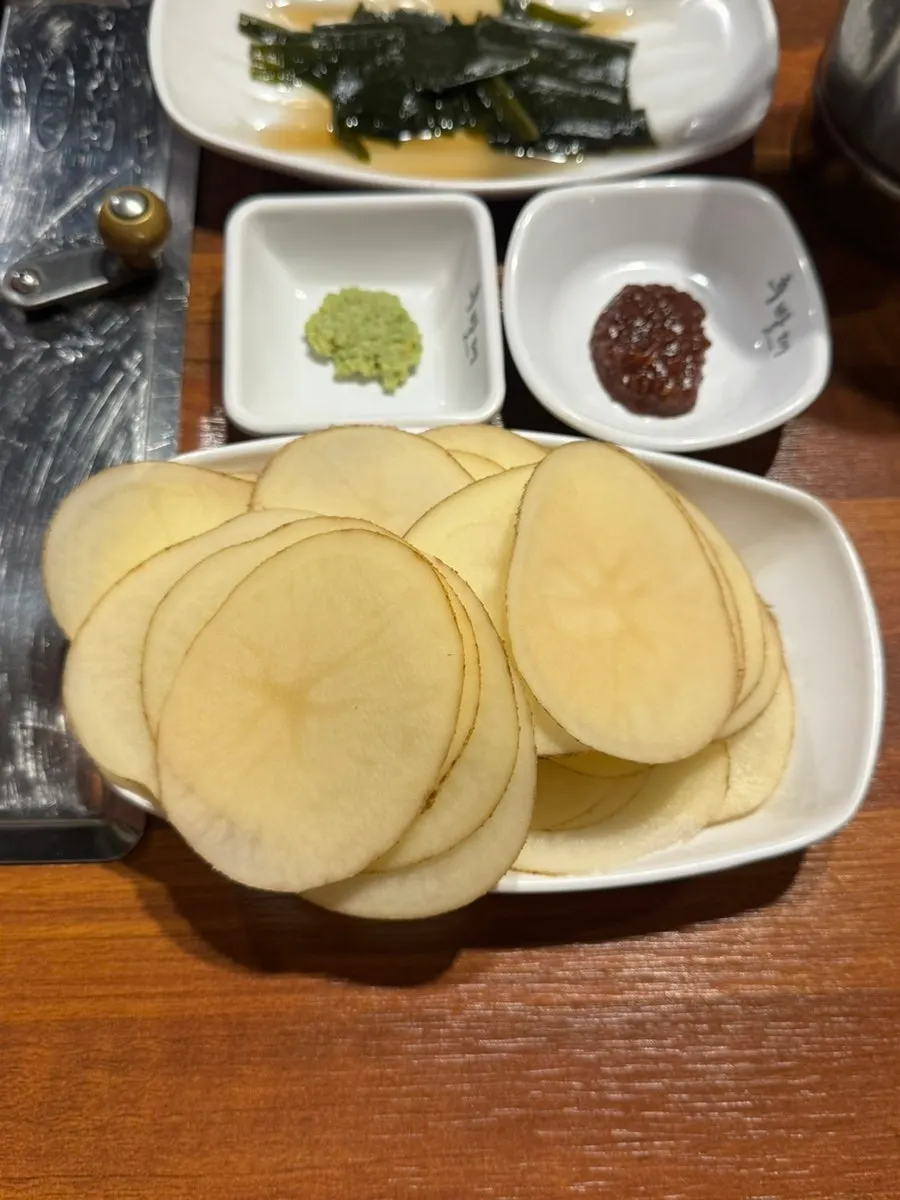 Cold noodle broth served as part of the basic spread