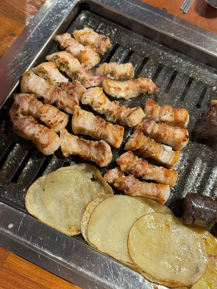 Close-up of the 168-hour aged fresh pork belly grilling