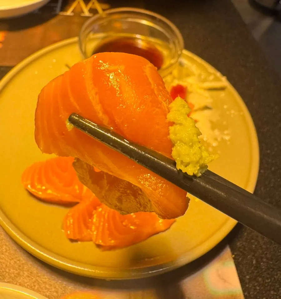 Salmon sashimi plated with wasabi