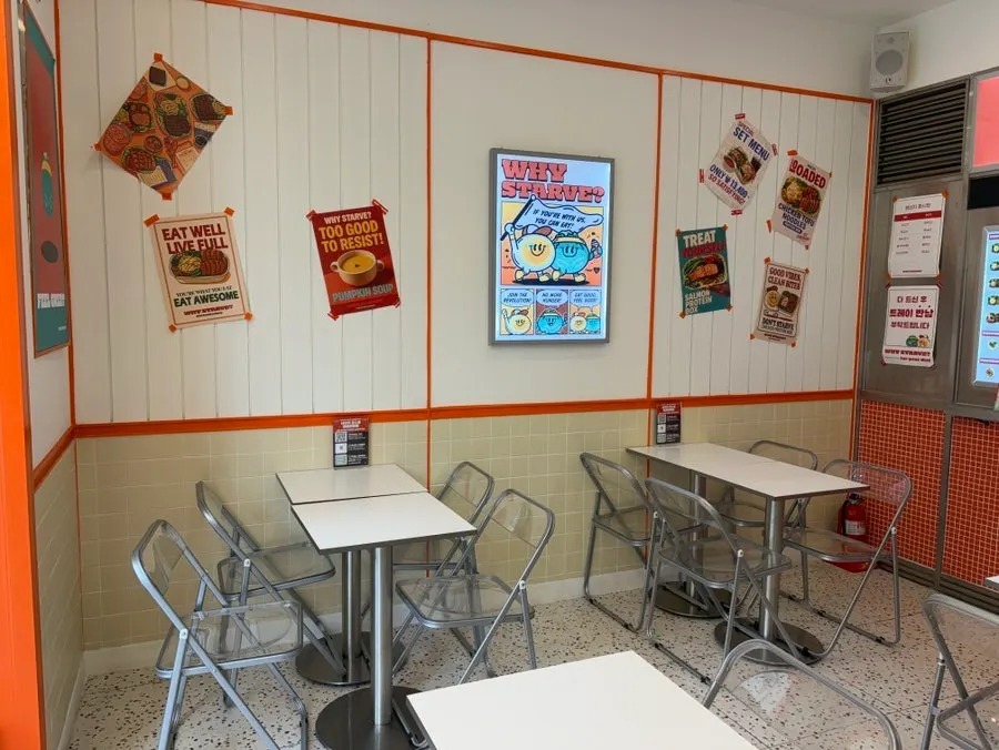 Salad shop interior with orange accents