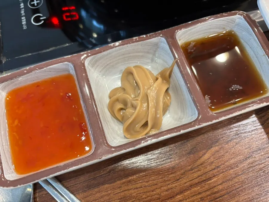 Three sauces served in small dishes