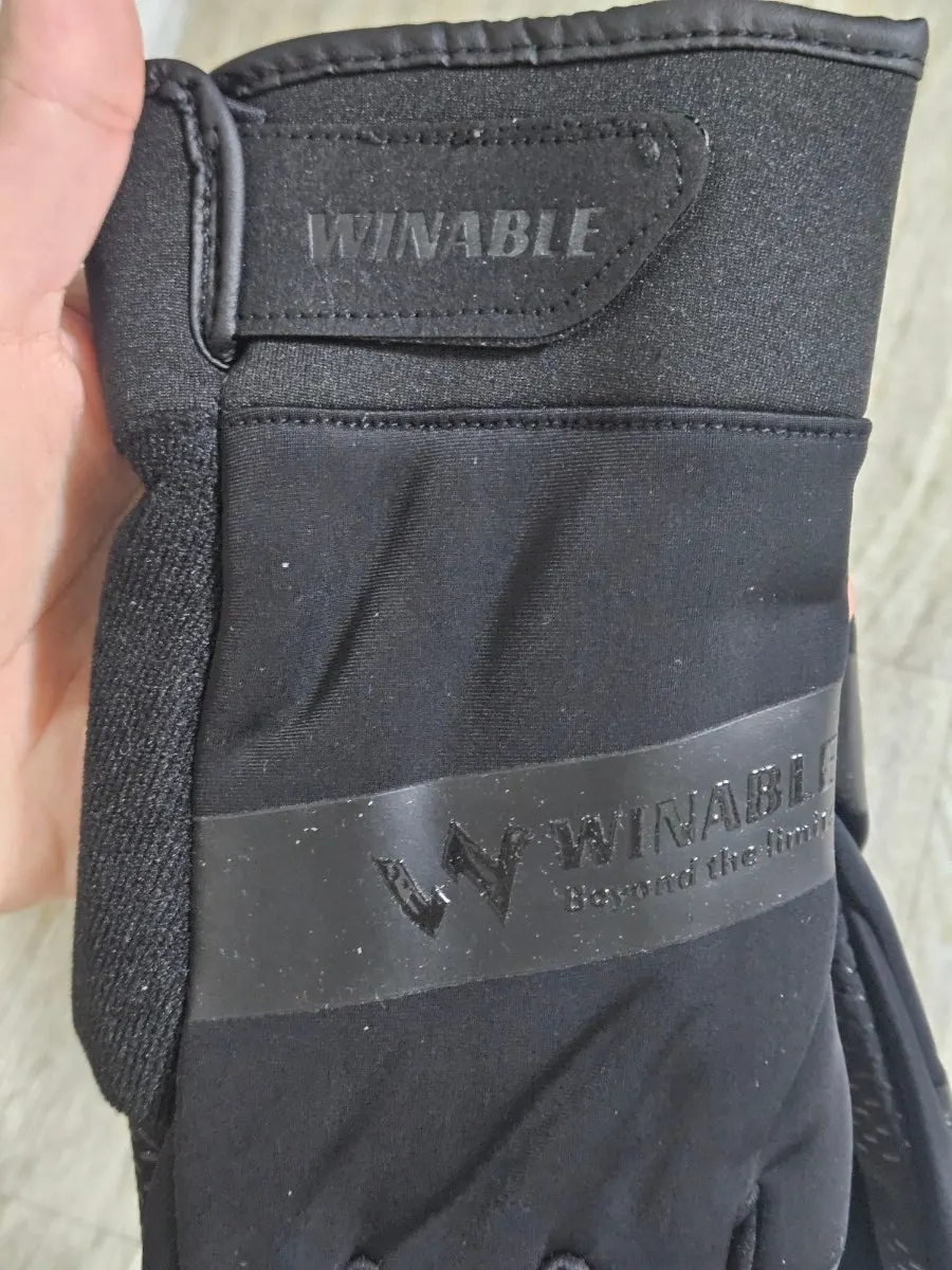 Simple black ski gloves being worn