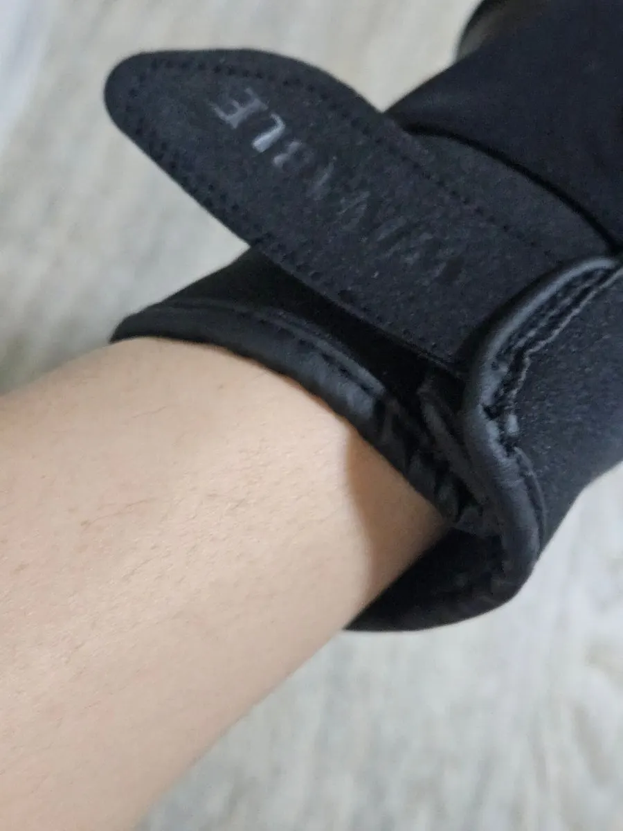 Black ski gloves worn outdoors