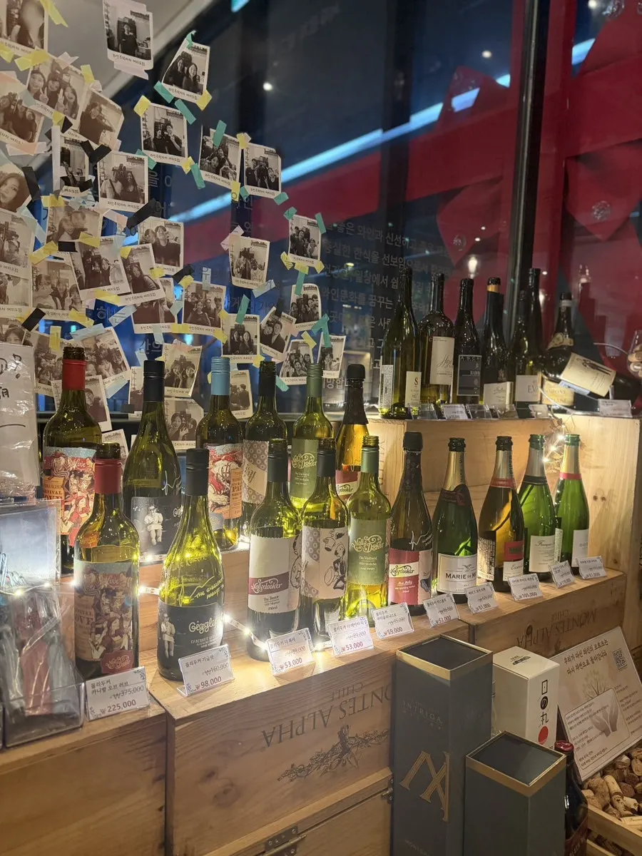Interior decorated with wine bottles from the entrance onward