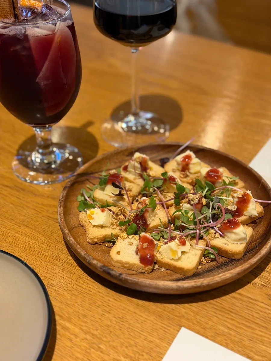 Toast topped with granola and radish sprouts