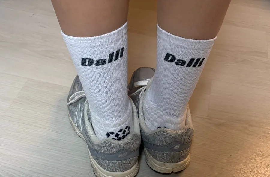 Lettering and finishing on custom sports socks