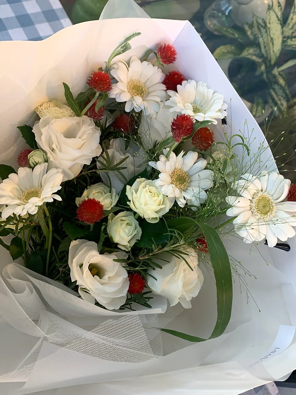Work table with a bouquet waiting for pickup