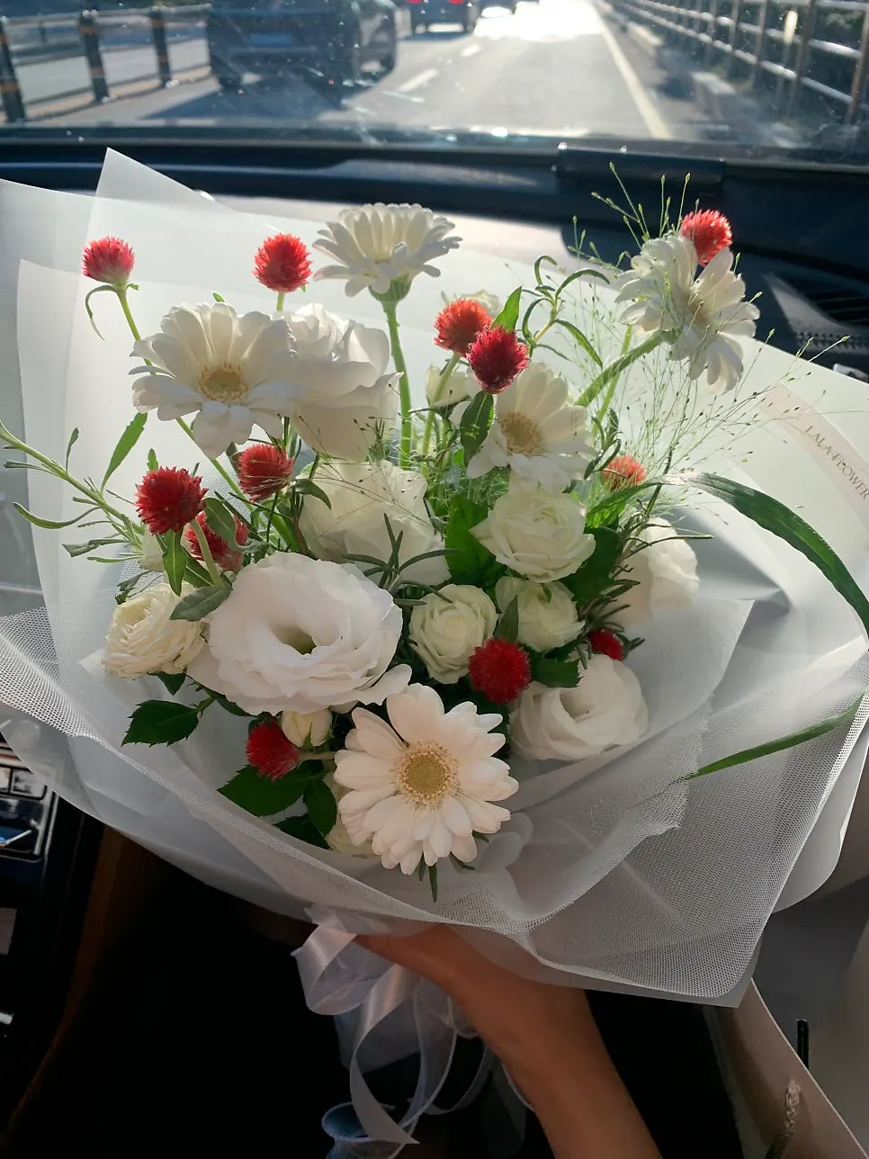 Wedding congratulation bouquet with white flowers and red accents