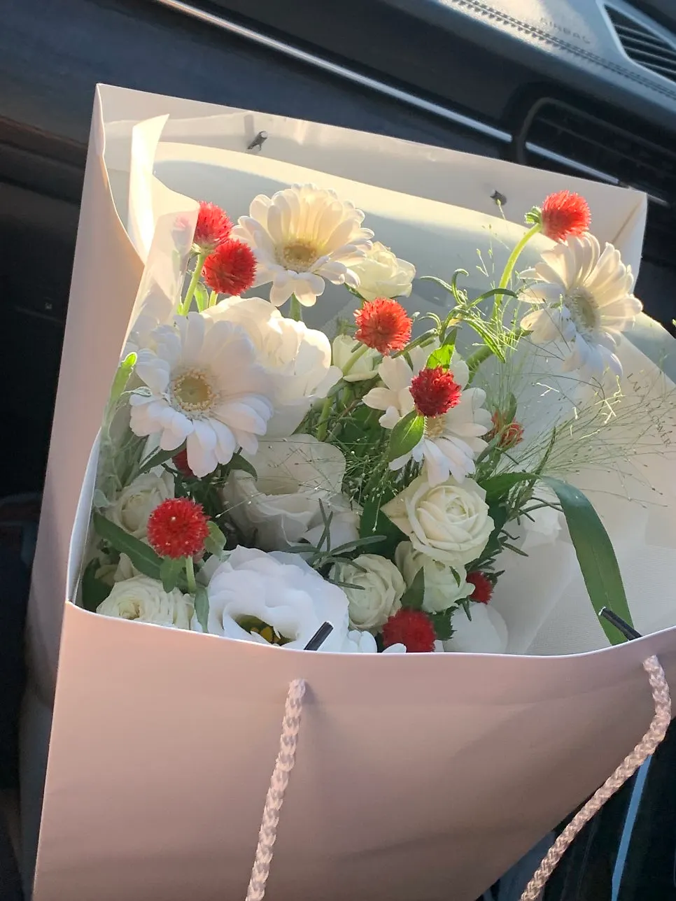 Bouquet neatly wrapped in white tones