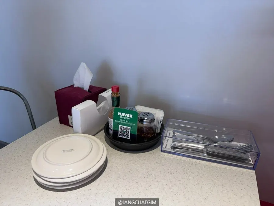 Table at Jackson Pizza Wirye Branch set with cutlery