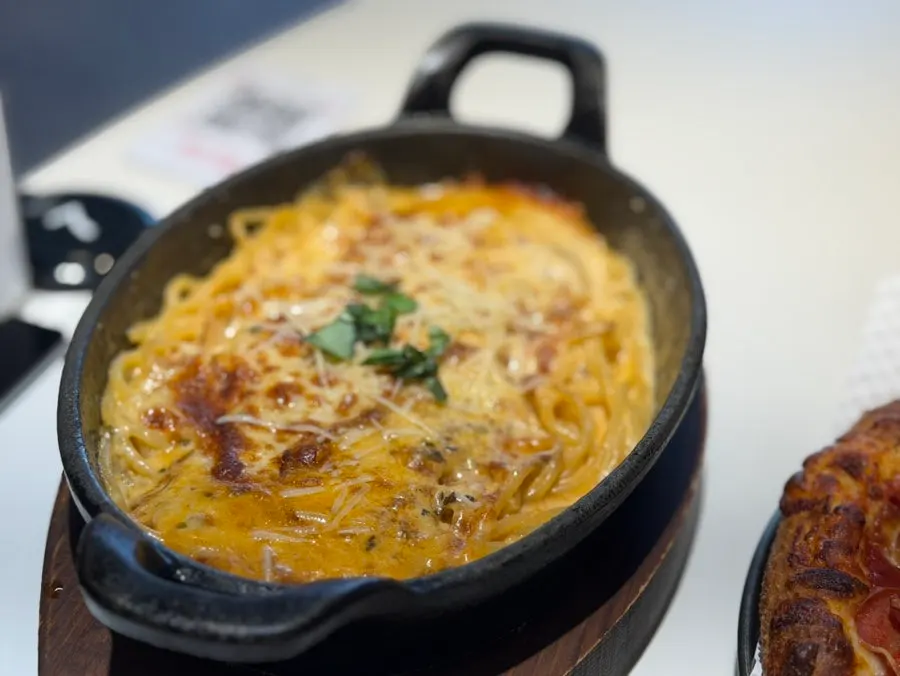 Rosé pasta topped with natural cheese