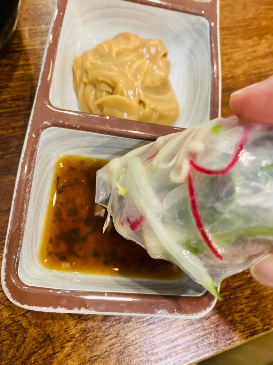 A shabu-shabu plate filled with fresh ingredients