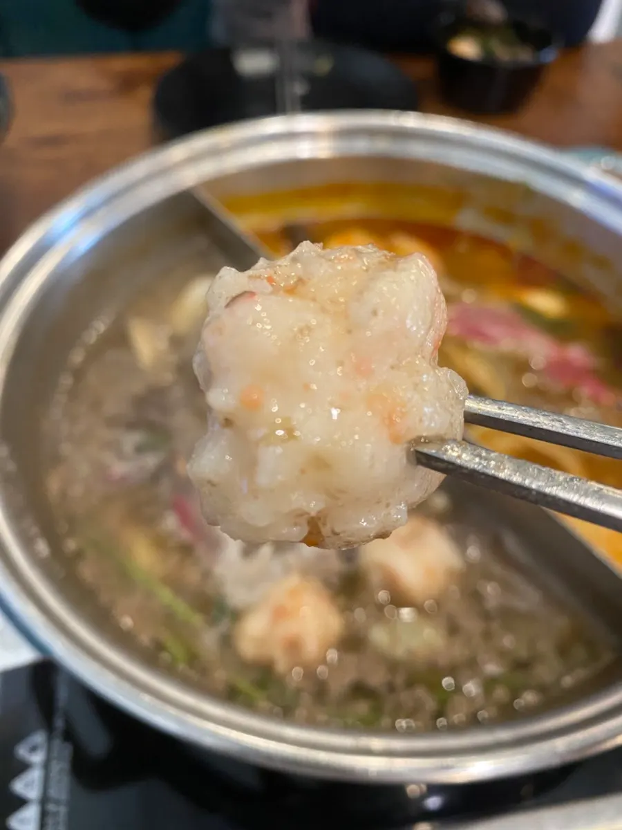 A full spread of fresh shabu-shabu ingredients