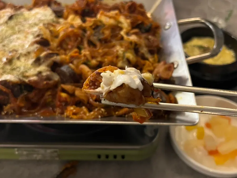 Vegetable cheese gopchang eaten with pickled onion