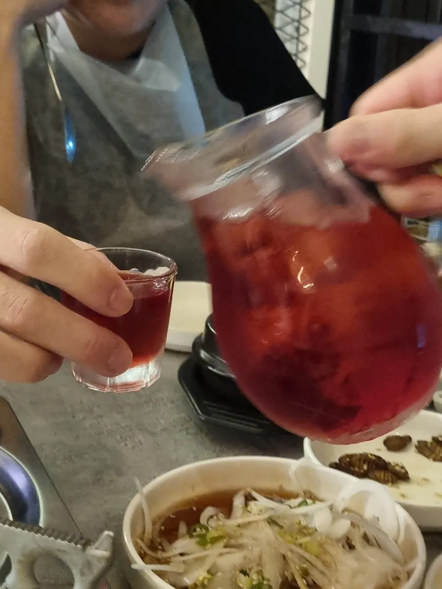 Drinks and side dishes on the window seat table