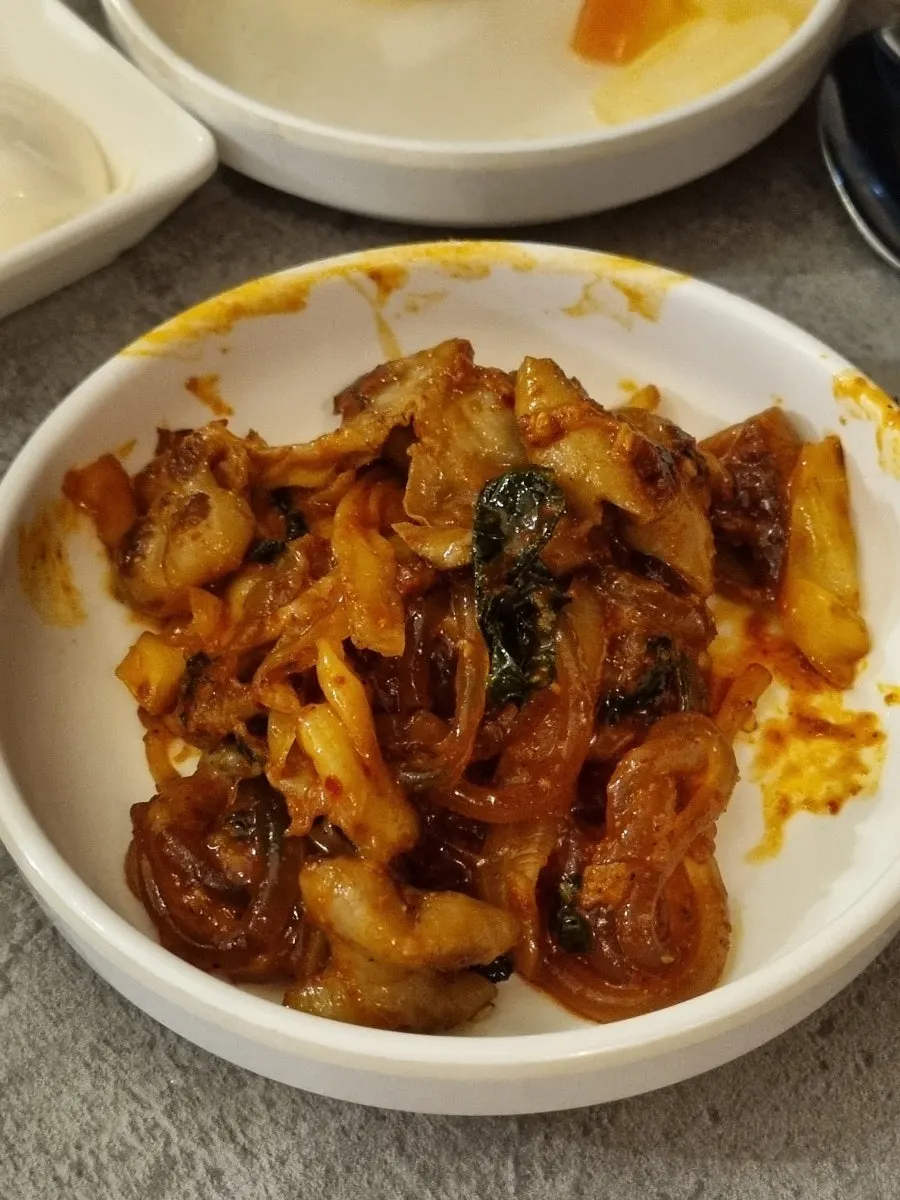 Hearty portion of gopchang, glass noodles, and cabbage