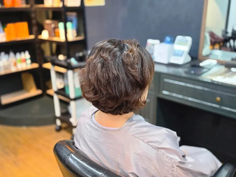 Hair ends damaged from a previous perm