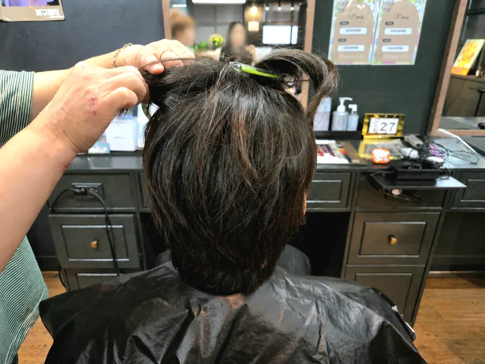 Hair sectioned off before the cut