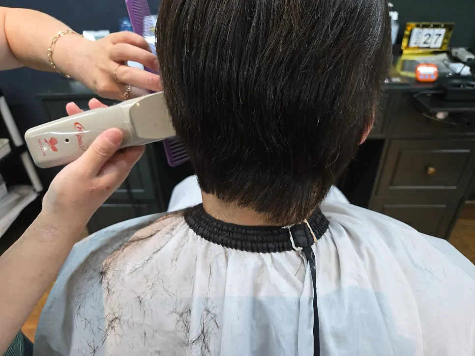 Back hair being trimmed into shape