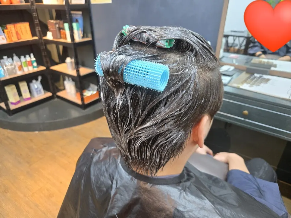 Straightening solution applied with rods rolled underneath