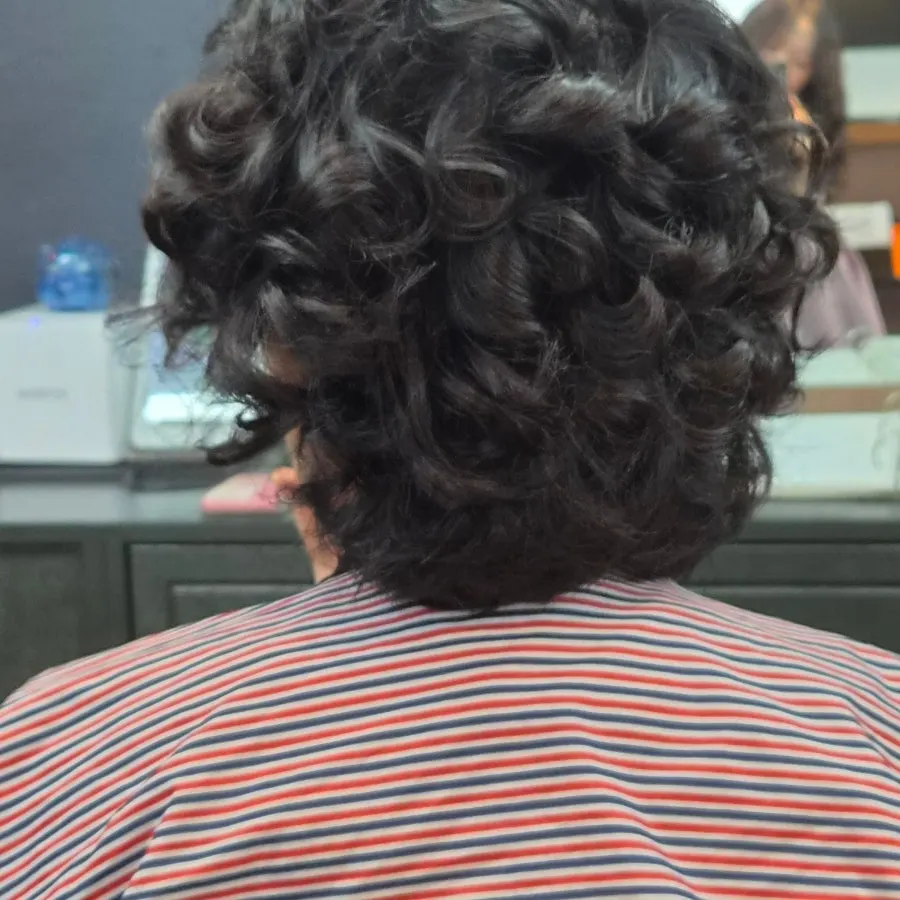 Sectioning and curling the hair during the iron perm