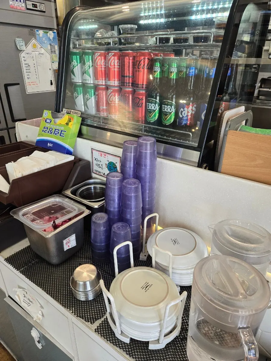 Hot sauce and parmesan cheese powder at the self-serve bar