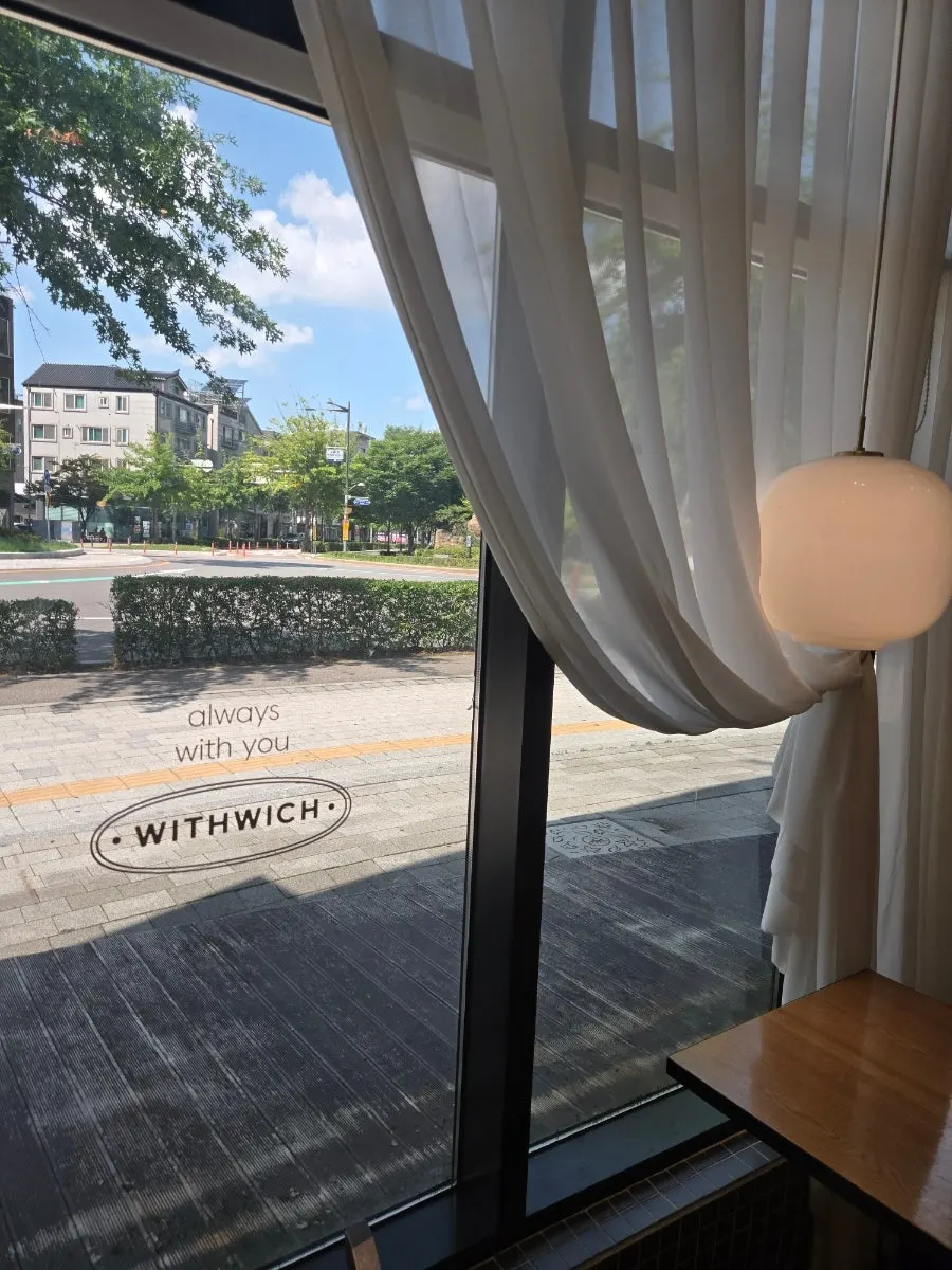 The brunch set for two laid out at a window table