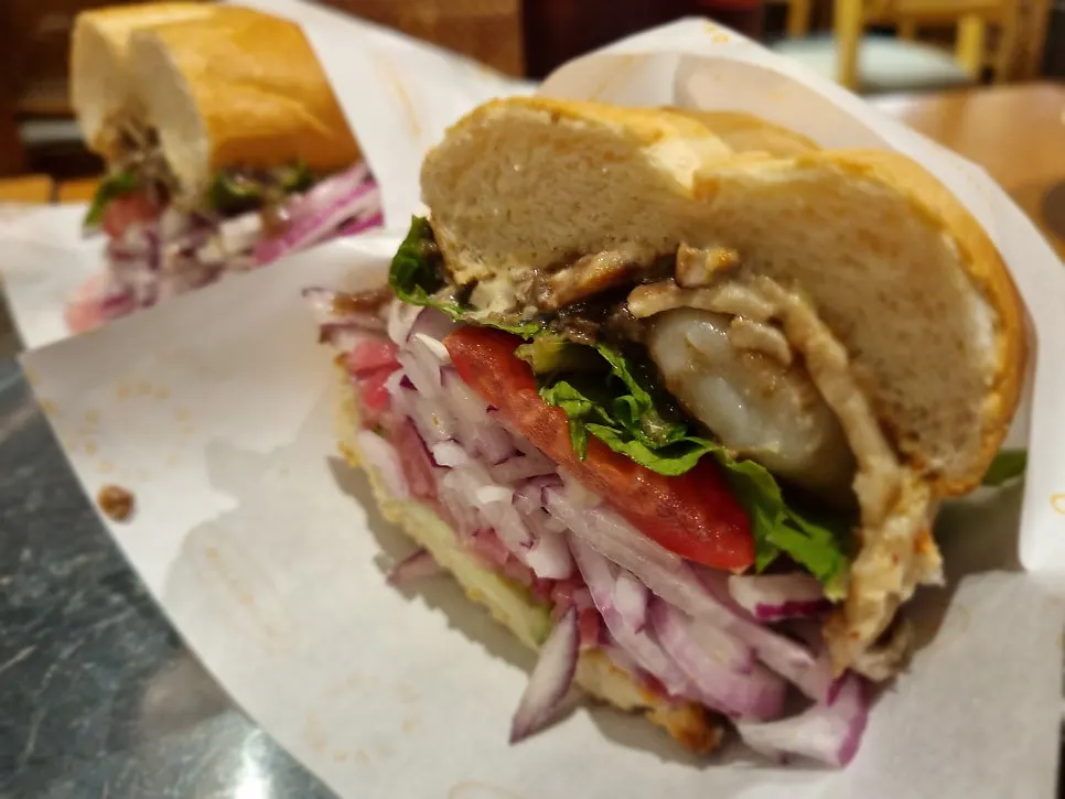 Cross-section of the truffle shrimp sandwich showing whole shrimp