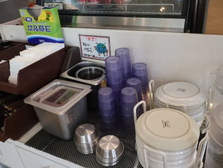 Plates and utensils at the self-serve bar