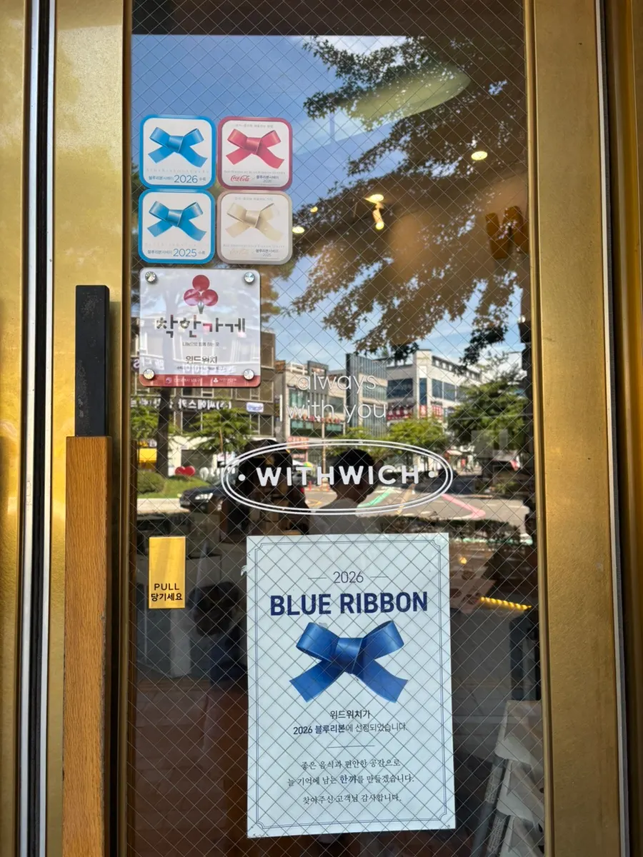 Withwich storefront with Blue Ribbon Survey marker