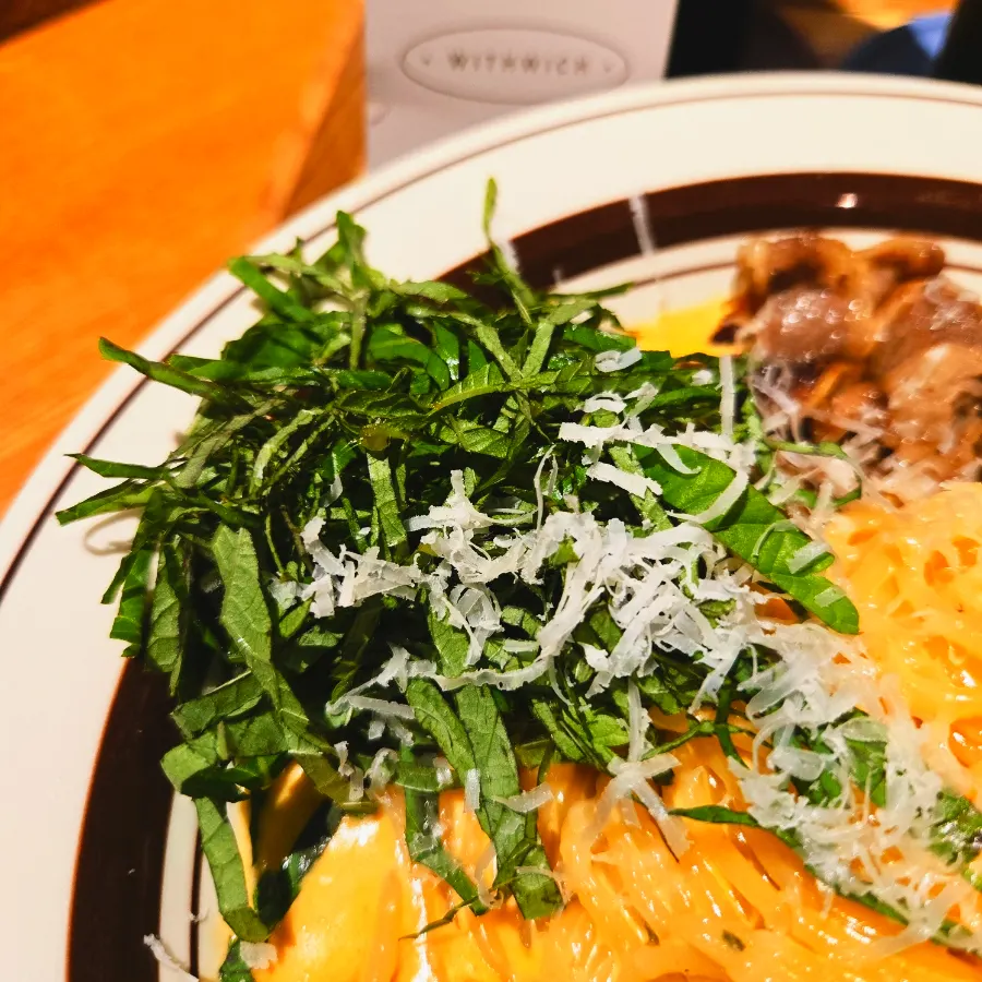 Woo samgyeop cream pasta topped with perilla leaf and cheese