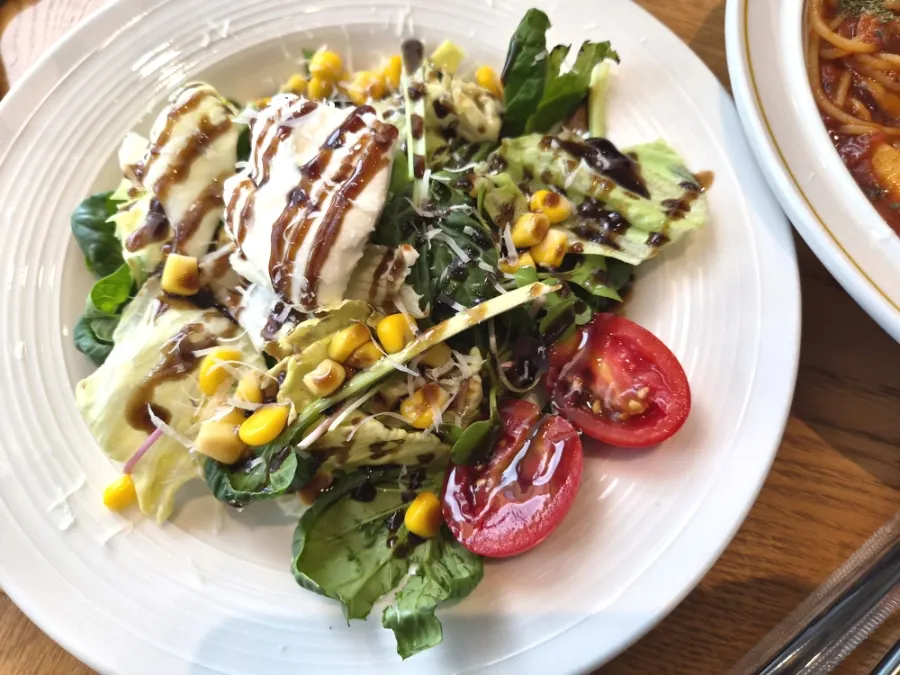 House salad topped with ricotta cheese