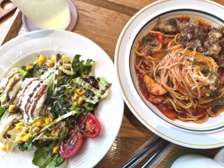 Table with pizza, pasta and salad set out together