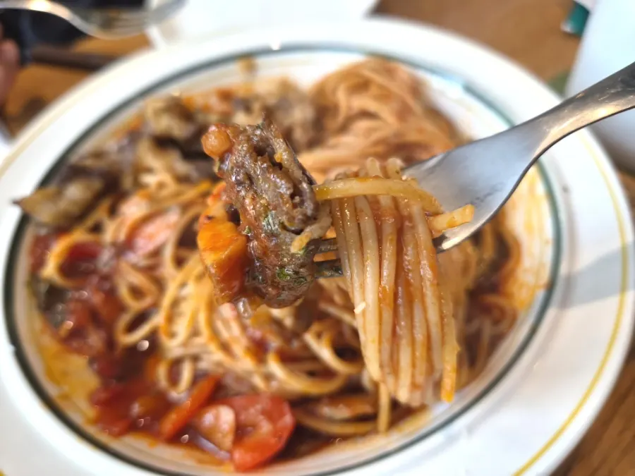 Beef brisket jjamppong pasta lifted on a fork