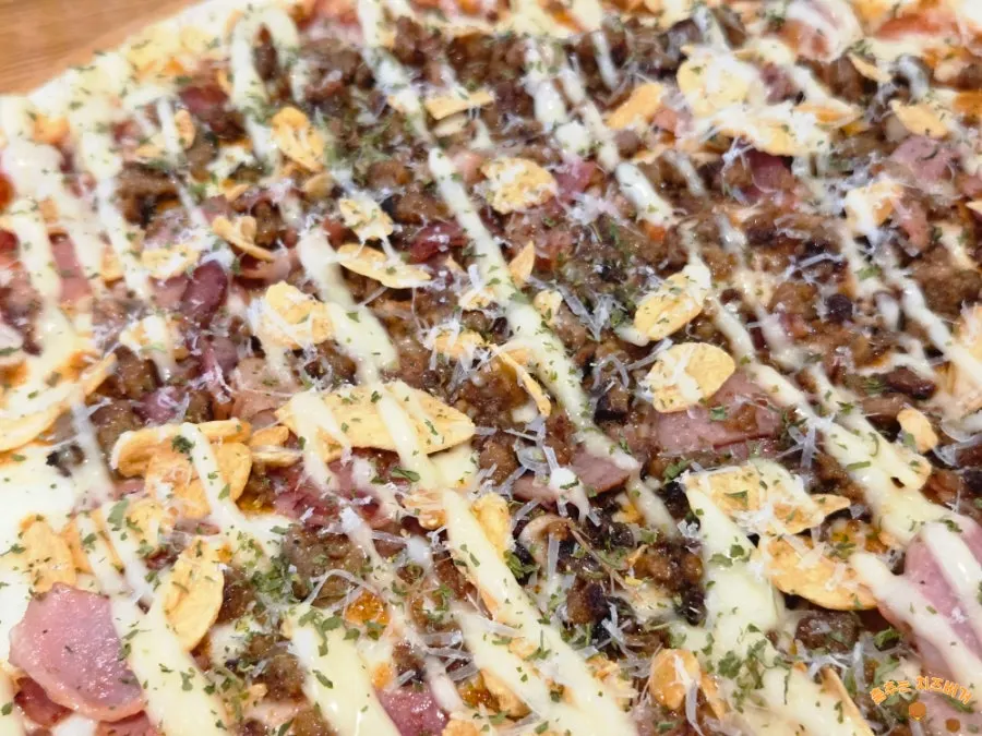 Thin-crust pizza piled high with toppings