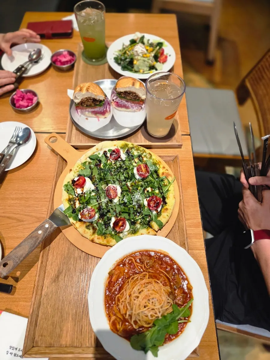 Full spread of the pasta and wood-fired pizza set for two