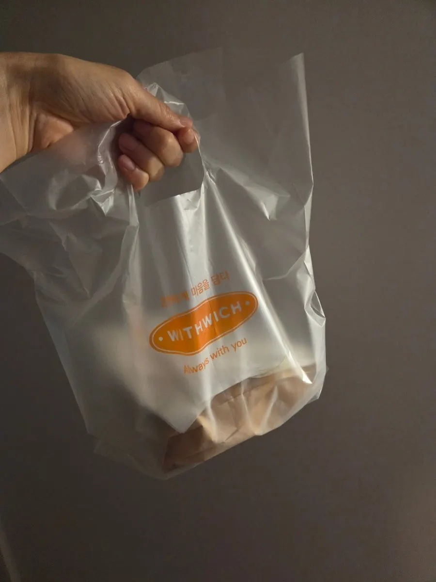 Half of the sandwich packed to take home