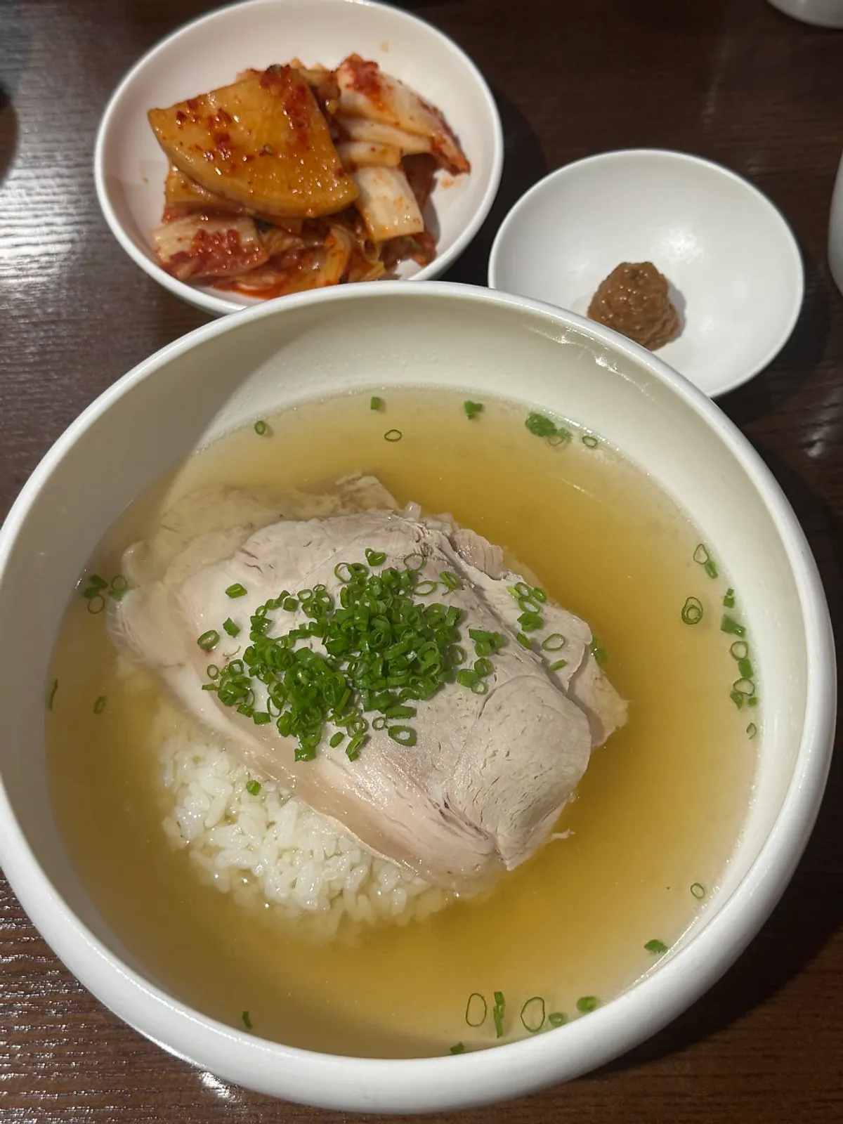A bowl of milky Wolhadong gomtang topped with meat
