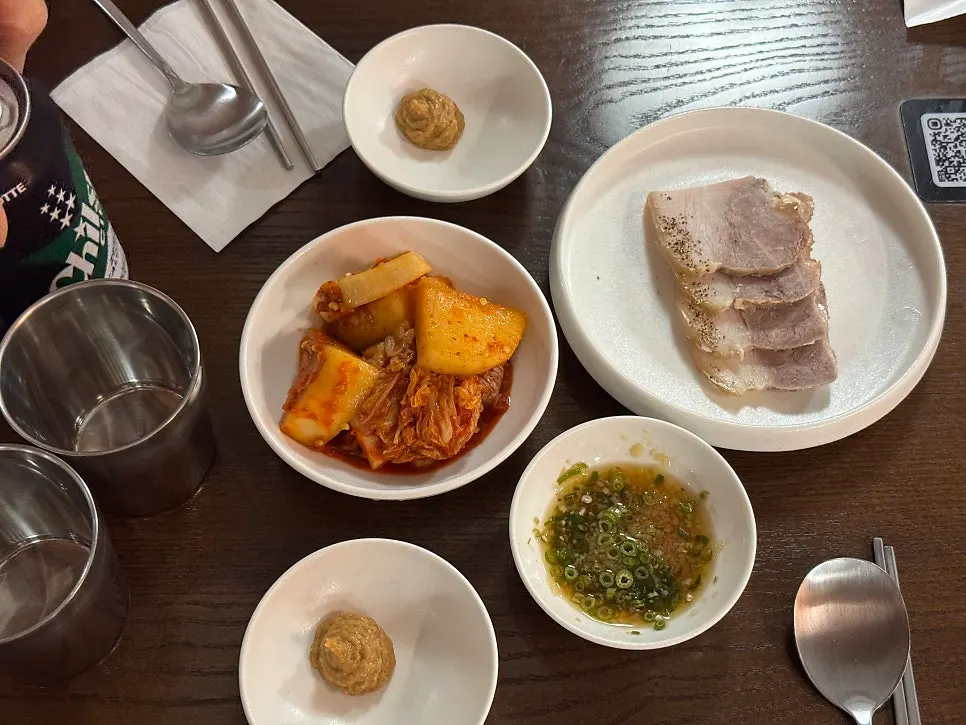 Table spread with gomtang for two and a taste of jeyuk