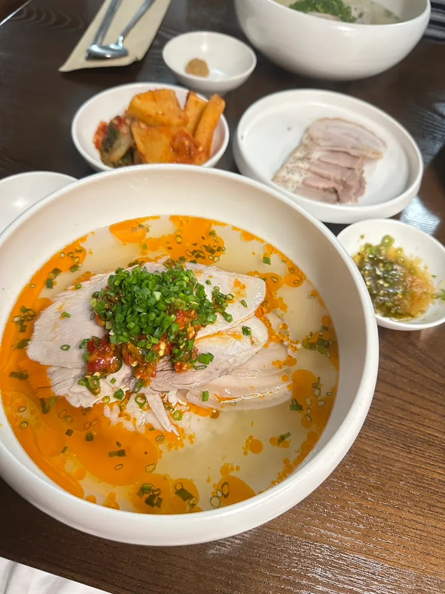 A bowl of spicy Hong Gomtang with chili oil