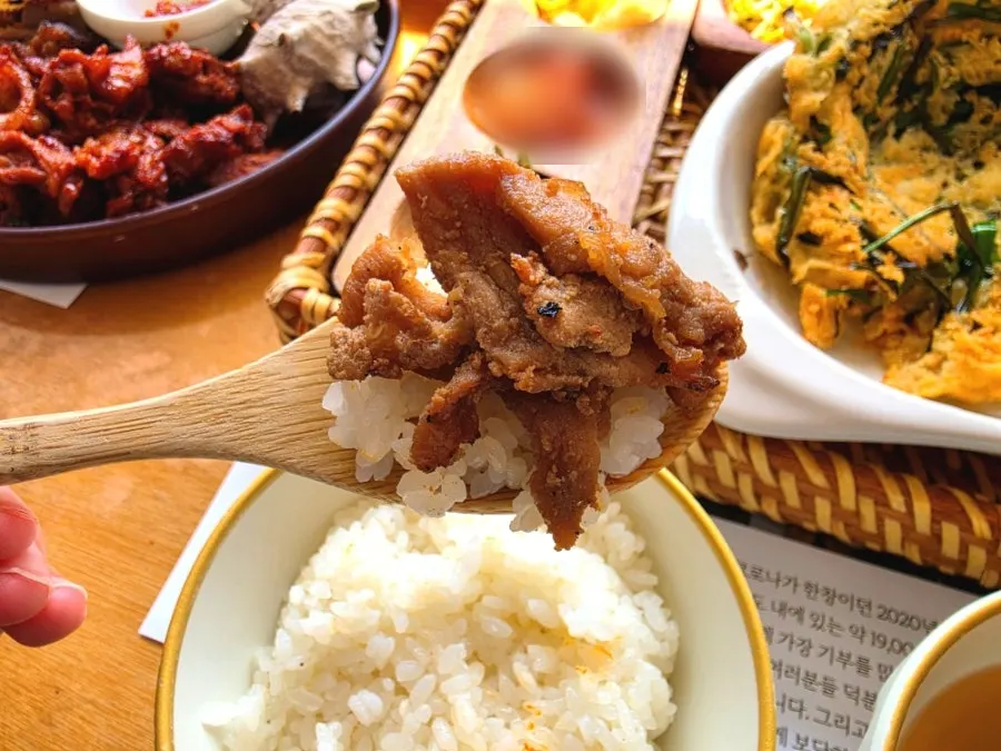A wrapped bite of soy sauce-flavored marinated meat