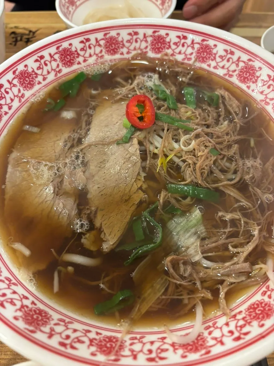 Warm pho broth and toppings