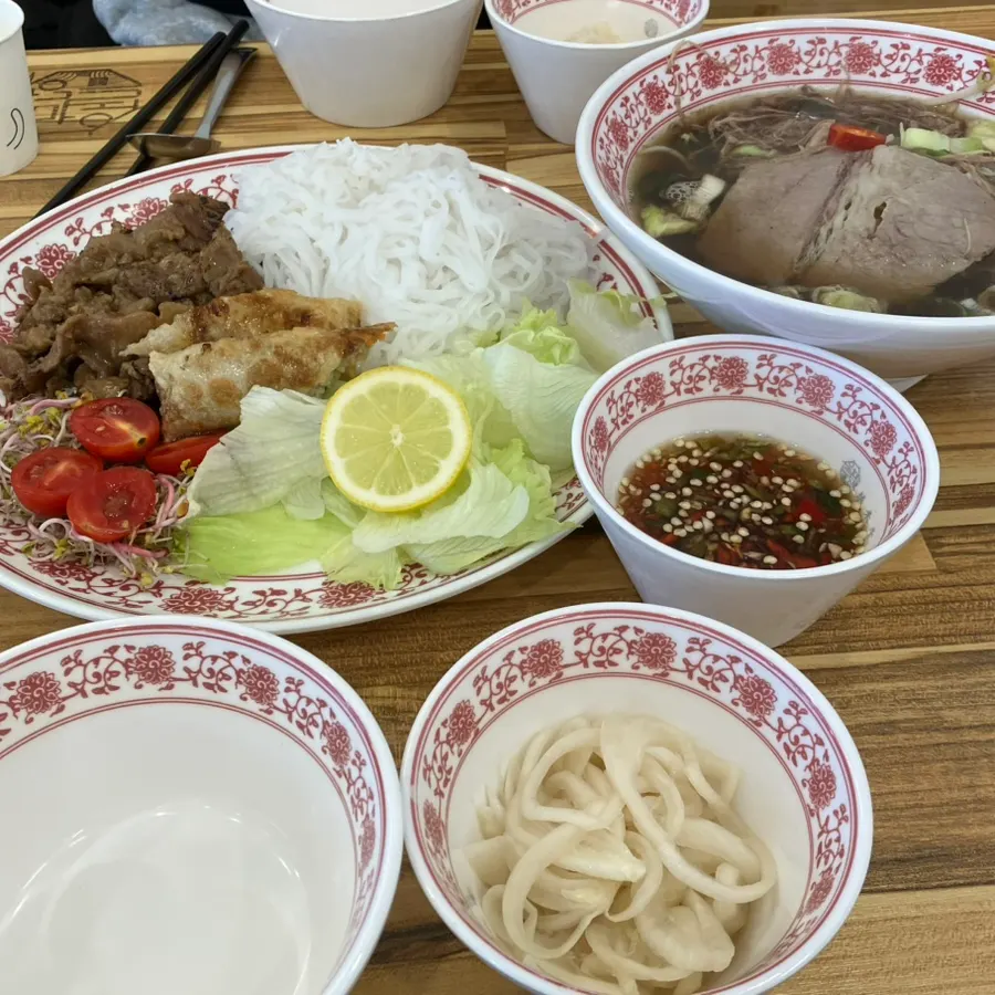 Lunch spread with bún chả and beef brisket pho together