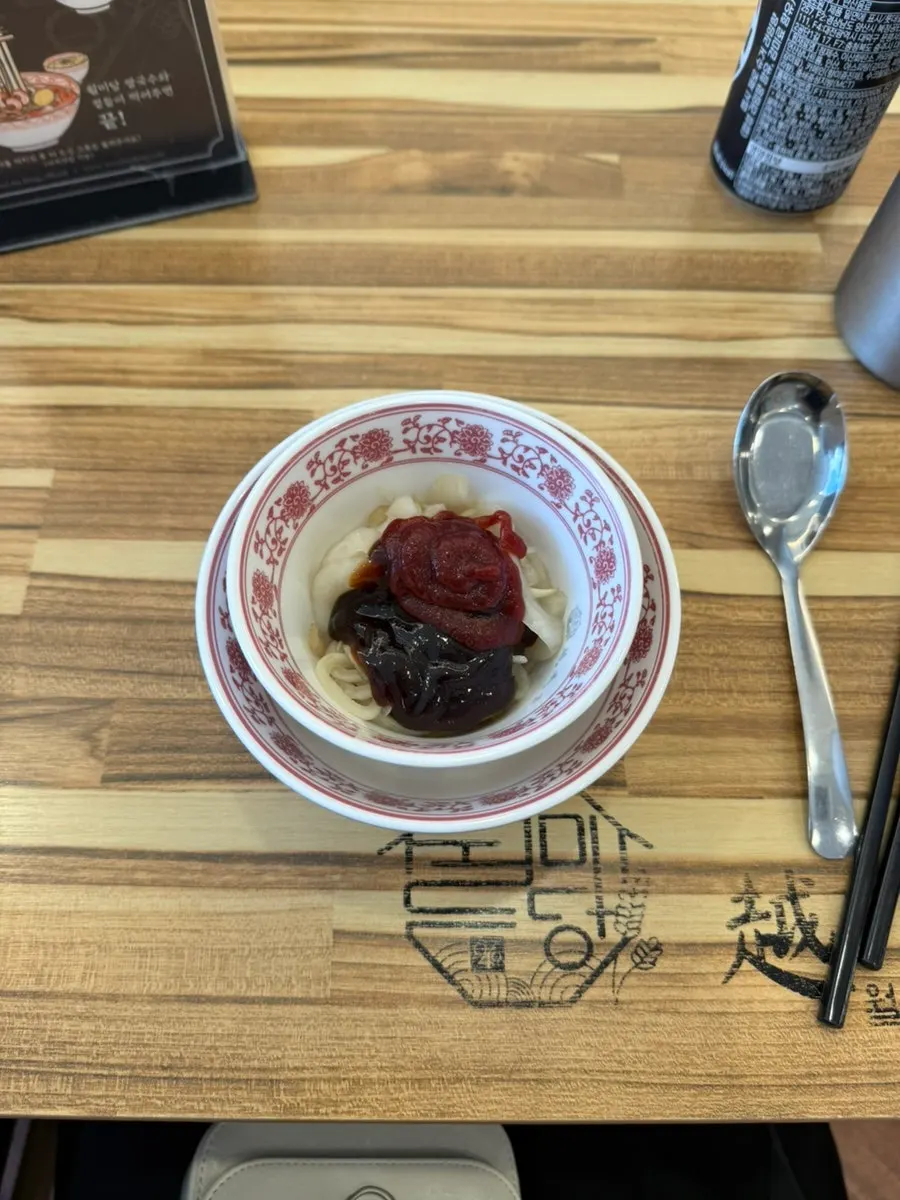 Onion pickle mixed with hoisin sauce and hot chili sauce