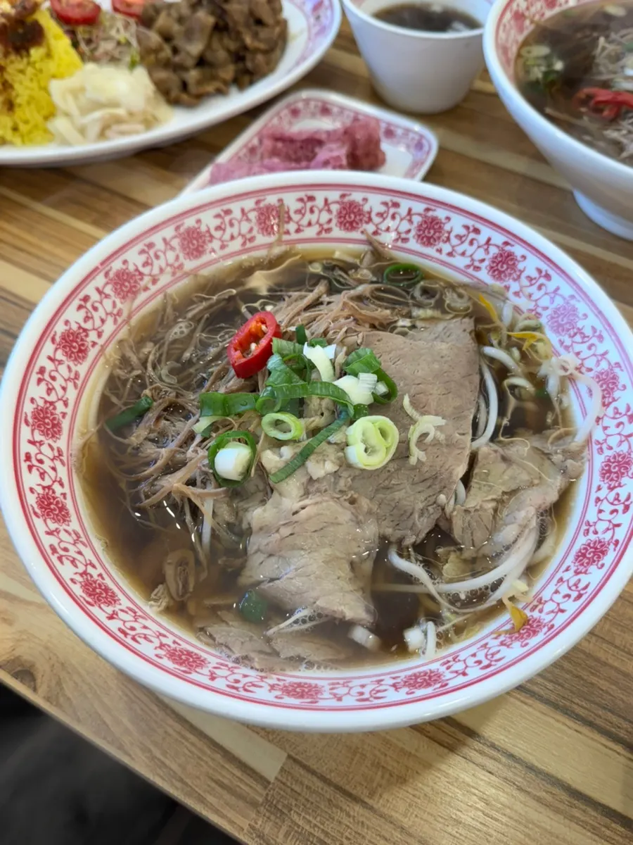 A bowl of beef brisket pho loaded with meat
